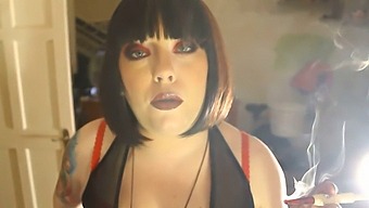 Tina Smua, A Plus-Sized Domme, Smokes A Cigarette In A Holder